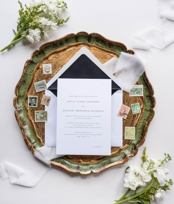 Photo by Fiona Murray-deGraaff a wedding stationery with a black and white envelope